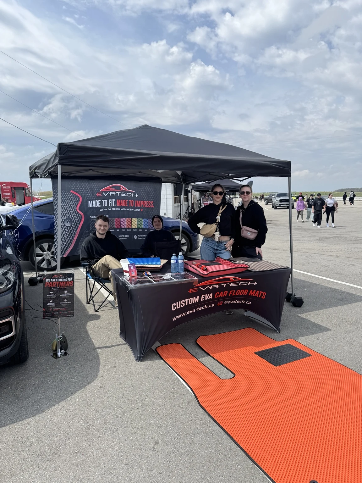 EVATECH display at an outdoor automotive event in Ontario